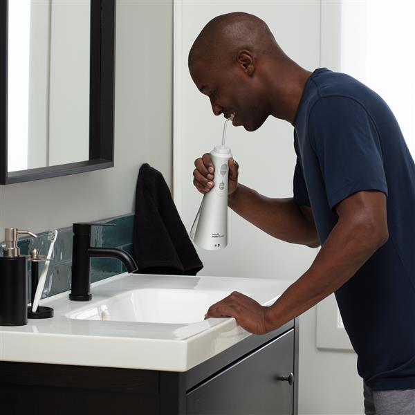 Irrigador Bucal Dental Portatil Waterpik WP 450 Cordless Plus blanco