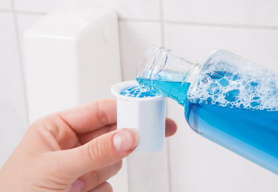 Enjuague bucal y su irrigador bucal Waterpik